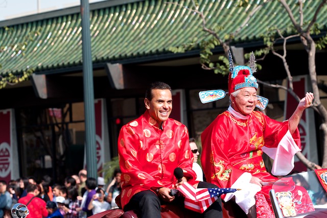 Los Angeles Mayor Antonio Villaregosa leads off the parade with this year's  grand marshall.