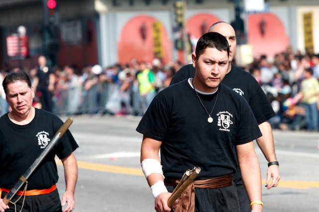 Members of Tai Mantis Kung-Fu Academy march down the parade route.
