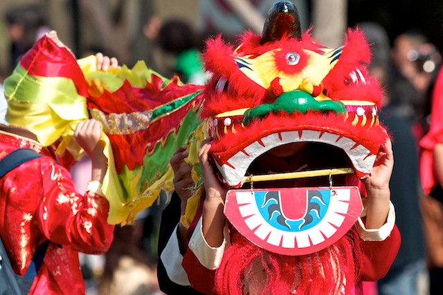 A dragon snakes its way down the street, chasing away evil spirits.
