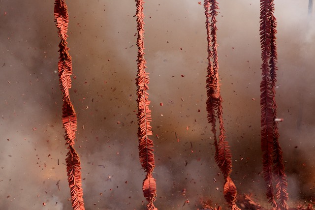 Firecrackers burst during the closing ceremony of the 2011 Golden Dragon Chinese New Year Parade.
