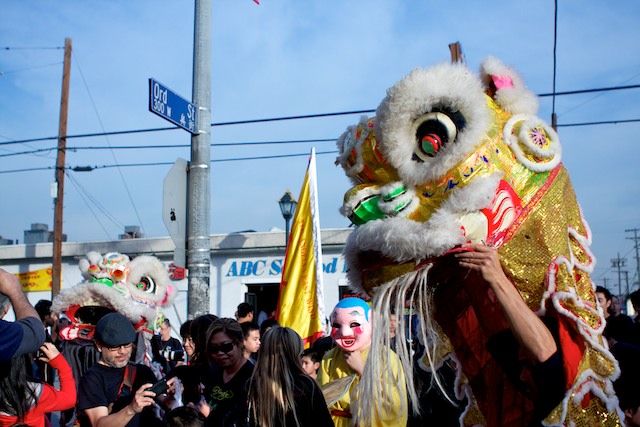 A Chinese lion perpares to enter a restaurant as part of Chinese New Year traditions in Chinatown.