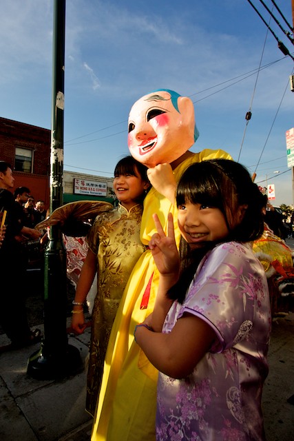 Children pose with the big head buddha.